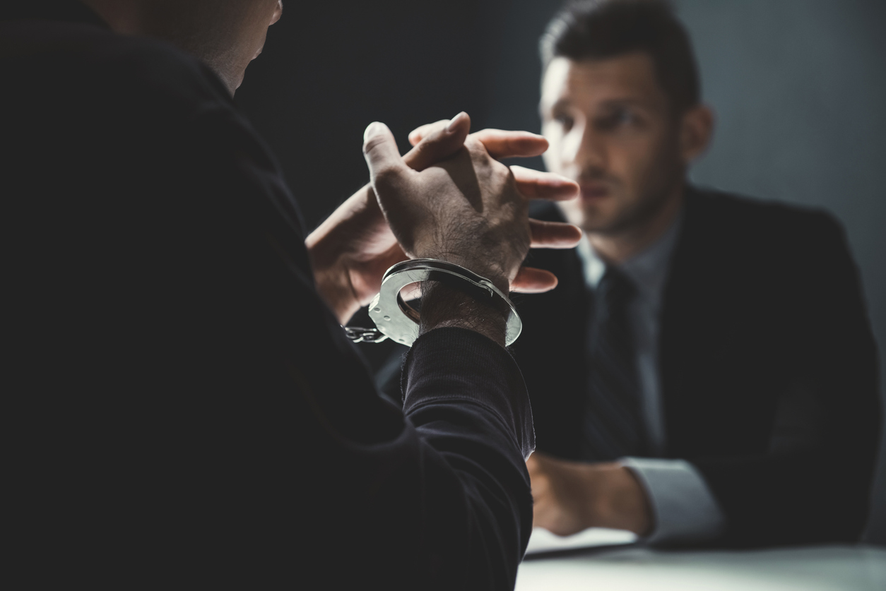 Person speaking with his criminal defense lawyer