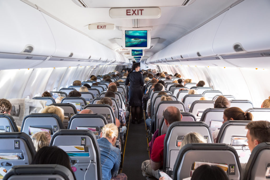 Inside view on passenger and cabin crew people on an airline